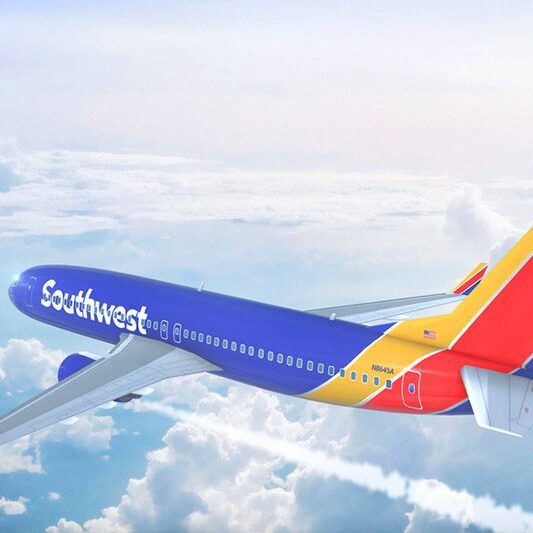Southwest Airline Plane in the sky with clouds